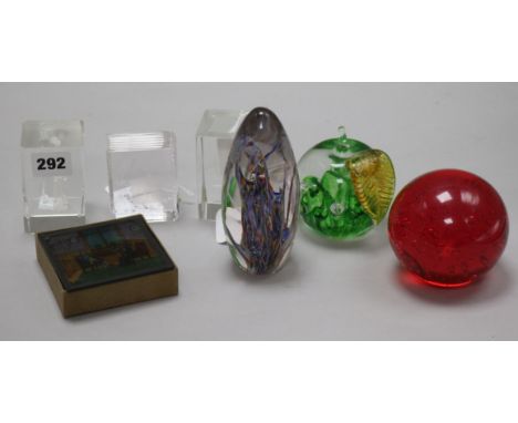 A box of eight coloured glass lantern slides, five various glass paperweights and a Stuart Crystal 'Book of Love'