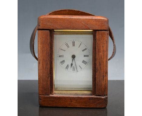 French brass case carriage clock, white enamel dial, platform escapement, 12cm in a wooden carrying case.