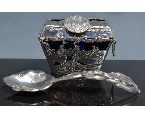 Dutch silver casket shape salt, 19th Century, with a blue glass liner, decorated with figurative scenes, the lid clip designe