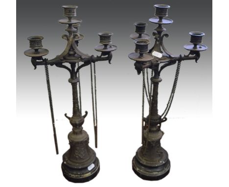 Pair of French Spelter four light candelabra, with chain swags, circular bases banded in marble, 53cm.