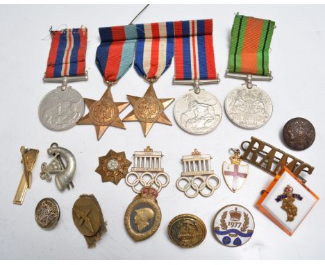 Group of three WW2 medals, including the France and Germany Star, a WW2 pair, badges and buttons together with two 1936 Berli