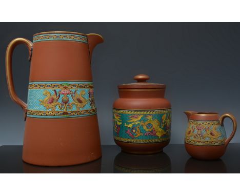 A Pratt Ware Terracotta tapering jug,  with Renaissance style enamel band, 21cm and five other items of Terracotta ware with 