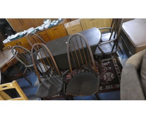 An Ercol Drop Leaf Table and Six Ercol "Quaker" Style Hoop Back Dining Chairs, Some Restoration Required 