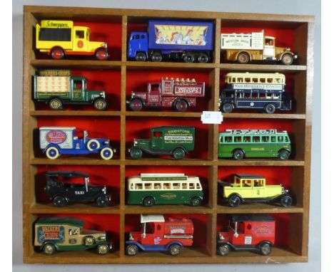 A Wooden 15 Display Section Containing Diecast Models of Vintage Buses 