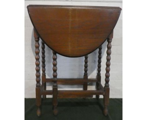 A Mid 20th Century Oak Drop Leaf Gate Legged Oval Topped Table with Bobbin Supports, 58cm Wide 