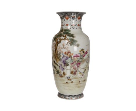 A Chinese porcelain vase, enamel painted with a figure on horseback and two further figures in a landscape. 27.5cm