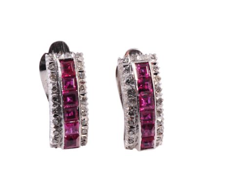 A pair of ruby and diamond earrings, of curved formation, the front set to the centre with a raised mount of six channel set 