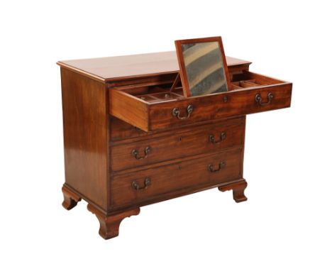A George III mahogany dressing chest, the moulded rectangular top above a drawer fitted with a tooled leather inset writing s