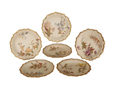 A set of six Royal Worcester shell plates, each decorated with flowers on a blush ivory ground, embellished with gilding, c.1