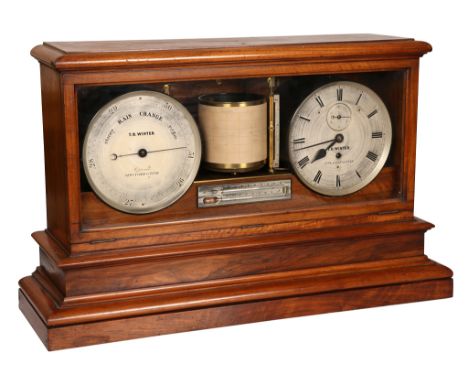 A Victorian walnut cased weather station, signed T.B. Winter, Newcastle on Tyne, with a central barograph above a thermometer