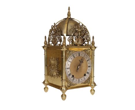 A 17th Century style brass lantern clock, the two train movement striking a top bell and internal bell on the hours and half 