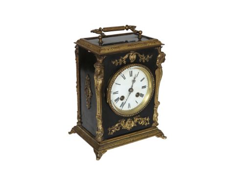 A late 19th Century gilt brass mounted ebonised carriage clock, with carrying handle and caryatid mounts, the two train movem