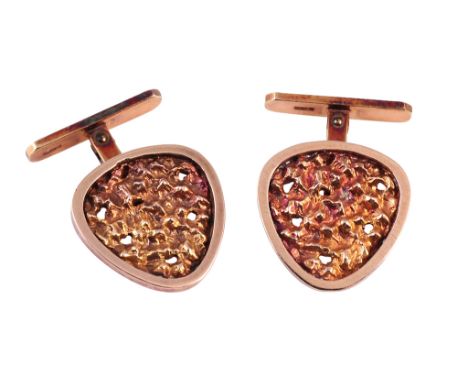 A pair of yellow gold cufflinks, the abstract circular design set to the centre with pierced detail hammered effect gold work