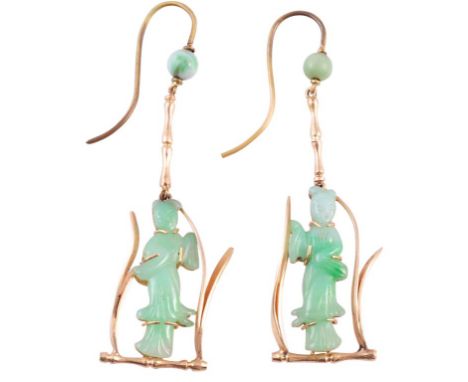 A pair of jadeite earrings, c. 1890, the jadeite plaque carved into the shape of a Geisha, enclosed in a bamboo style setting