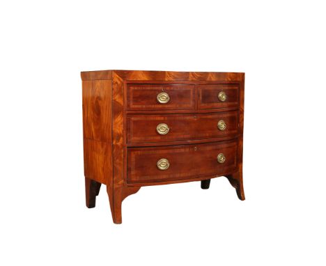 A mahogany bow front chest of drawers, in Regency style, with two short over two long graduated drawers, the fronts with cock