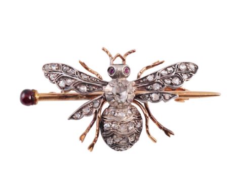 A diamond and garnet butterfly brooch, circa 1870, the body set to the top with a single rose cut diamond in heavy collet and