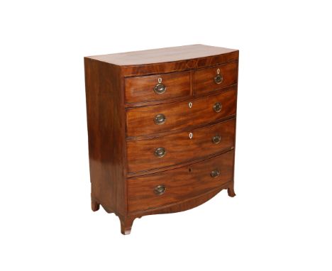 A Regency mahogany bow front chest of drawers, the crossbanded and string inlaid top above two short over three long graduate