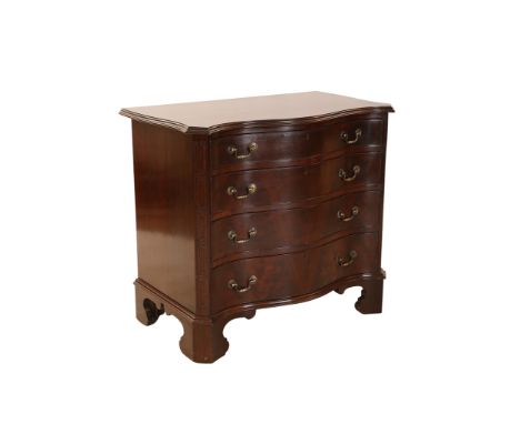 A George III style mahogany serpentine chest of drawers, the moulded top above four long graduated drawers, flanked by blind-