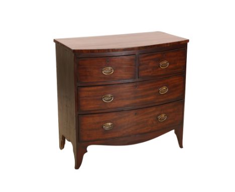 A small Regency mahogany bow front chest of drawers, fitted with two short over two long drawers, with cockbeaded fronts and 