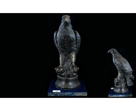 A Vintage Bronzed Plaster Figure In The Form Of An American Eagle Raised on circular base attached to square silestone plinth