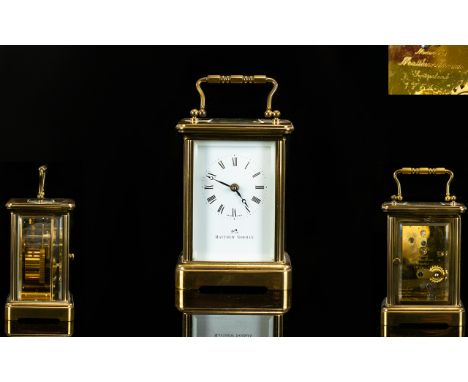 Matthew Norman Superb Quality Brass Cased Carriage Clock with visible escapement, glass panel sides, white porcelain dial. Ma