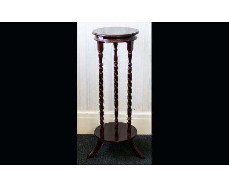 Mahogany Jardiniere Circular top and base, tripod legs barley twist pilasters. Height 34 inches.  