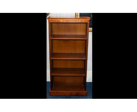 A Polished Veneer Three Shelf Bookcase of plain rectangular form. Height 48 inches, width 23 inches, depth 11.5 inches.