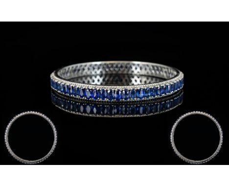 Sapphire Full Circle Bangle, 22cts of oval cut blue sapphires, set vertically in close formation, in a full circle of platinu