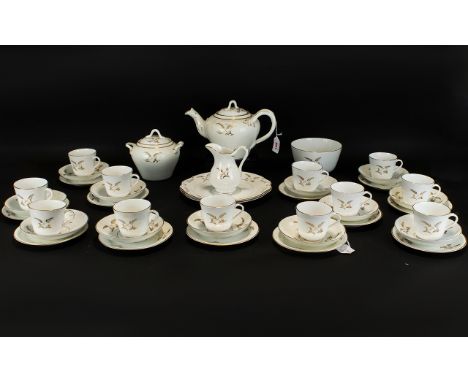 Part Tea Set (37) pieces in total. Comprises teapot, sugar bowl, two handled lidded sugar bowl, two cake. sandwich plates and