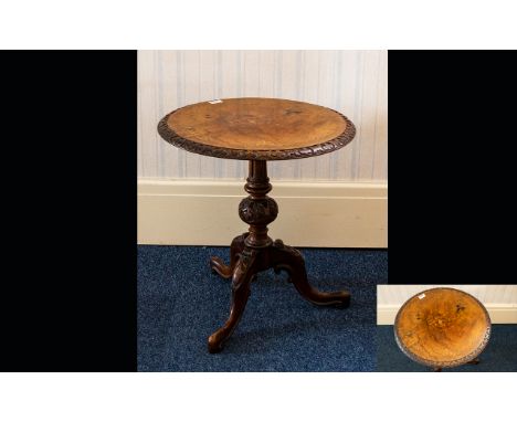 A 20th Century Tripod Table With blind fretwork edges, turned support, inlaid top and tripod legs. Height, 21 inches.