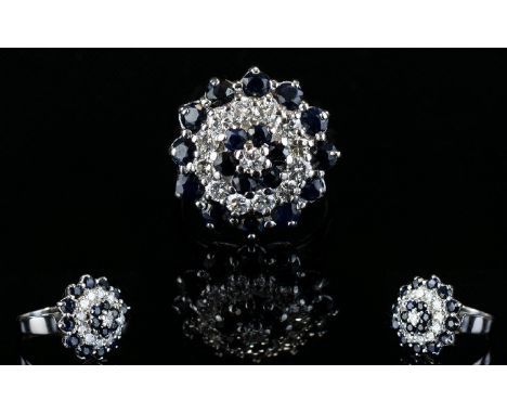 18ct White Gold Sapphire and Diamond Set Cluster Ring. In a Concentric Flower head Setting ( Design ) The Sapphires and Diamo