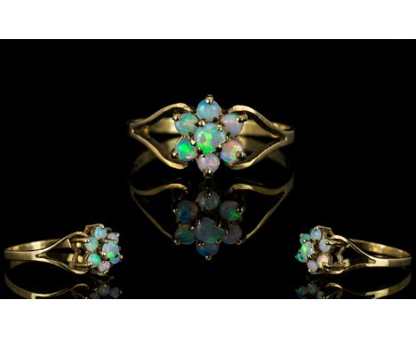 Ladies - 9ct Gold Opal Set Cluster Ring. Flower head Setting. The Central Opal Surrounded by a Further Six Opals. Fully Hallm