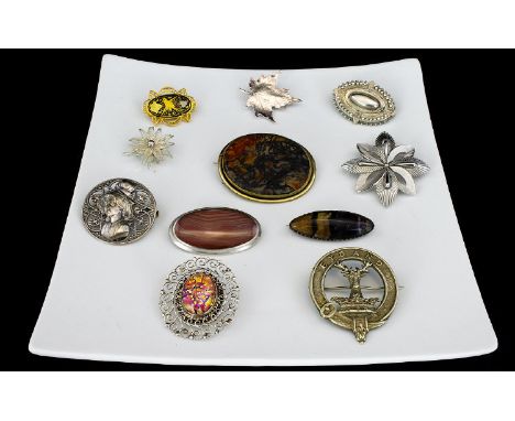 A Collection Of Vintage Silver And Mixed Metal Brooches Eleven in total to include Trifari 1950's silver tone flower brooch, 