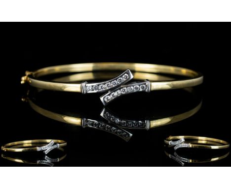 Ladies 9ct Gold Hinged Bangle Set with 14 Diamonds of Good Colour and Clarity. Est Diamond Weight 0.50 pts. Fully Marked for 