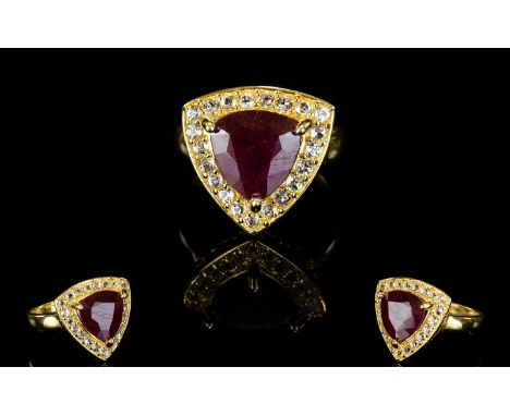 Ruby and White Topaz Trillion Shape Ring, a 6.5ct trillion cut ruby, framed with sparkling white topaz, bringing the total to