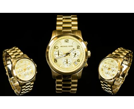 Michael Kors MK5055 Runway PVD Gold Plated Chronograph Watch. Features Champagne Coloured Dial, Multi Dial Clock Face, Chrono