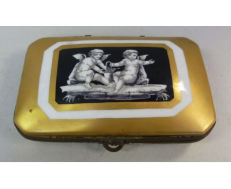 A late 19thC Continental porcelain trinket box with an applied gilt metal rim, the hinged lid decorated with cherubs, on a gi