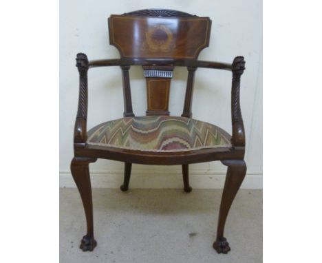 An early 20thC string inlaid marquetry and mahogany framed salon chair, having a carved, arched tablet crest with wreath orna