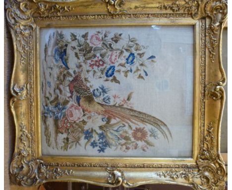 A late Victorian needlework tapestry, depicting a pheasant drinking from a fountain surrounded by flora and foliage  25'' x 2