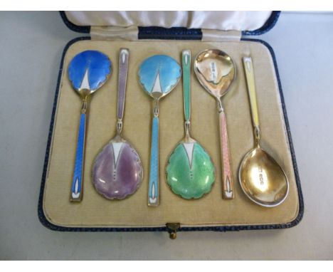 A set of six silver gilt presentation spoons, having an engine turned, multi-coloured enamelled bowls and handles  Walker & H