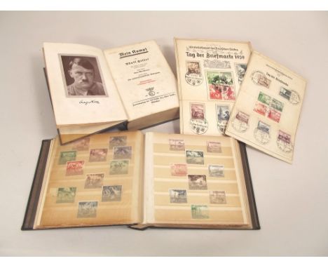 WWII GERMAN STAMPS ETC.A stock book of over 150 German Third Reich stamps, commemorative & definitive, used & unused & two fi