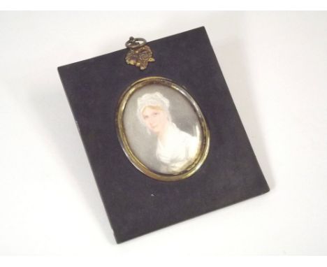 PORTRAIT MINIATURE. A 19th century portrait miniature, painted on card, of a young woman.