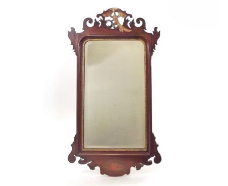 WALL MIRROR. A walnut wall mirror with gilt eagle finial. PLEASE NOTE: Our in-house, postal shipping service is NOT available