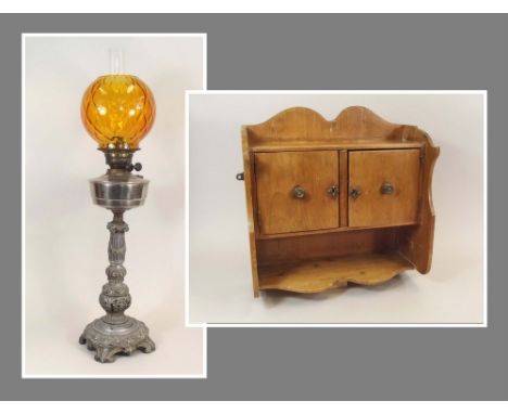 OIL LAMP ETC.An oil lamp with ornate cast metal column, height 76cm & a small pine wall cabinet, height 40cm.PLEASE NOTE:  Ou