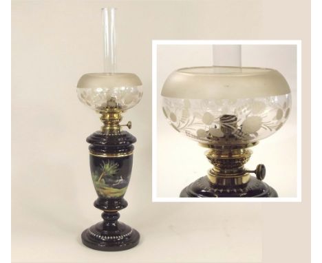 OIL LAMP.A 19th century hand painted black glass oil lamp with black glass inset reservoir & etched shade. Height 64cm.PLEASE