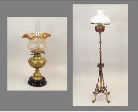 OIL LAMPS.A Victorian brass oil lamp, height 55cm, a 19th century brass & copper telescopic standard oil lamp & a glass shade