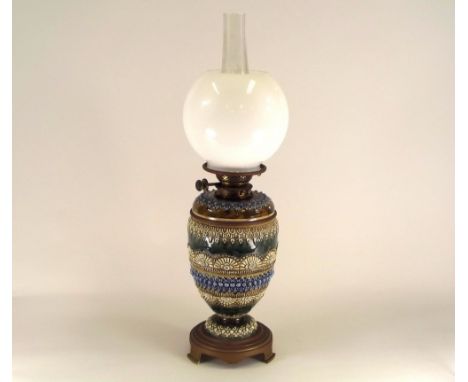 DOULTON STONEWARE. A Doulton Lambeth brass mounted oil lamp. Height 63cm. PLEASE NOTE: Our in-house, postal shipping service 