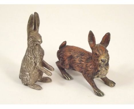 MODEL HARES. A cold painted spelter model hare, length 7.5cm &amp; a cast white metal hare, 8.5cm.