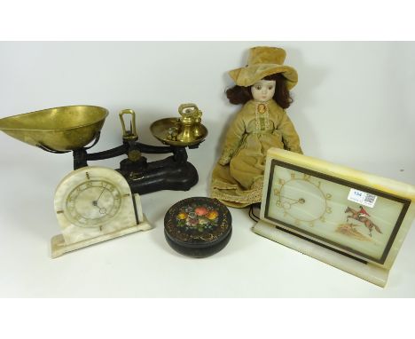 Two Vintage onyx mantle clocks, set of kitchen weighing scales and weights, a doll and vintage tin (5)   Condition Report   C