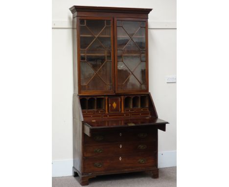 Early 19th century mahogany bureau bookcase, four graduating drawers, fall front revealing fitted interior, Corinthian and sh